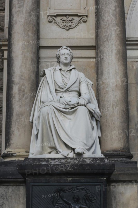 An upright shot of a statue to Germany's most famous poet and writer Johann Wolfgang (von) Goethe (1749 –1832), who is widely regarded as the greatest and most influential writer in the German language. Semper opera, Dresden, Germany, Europe