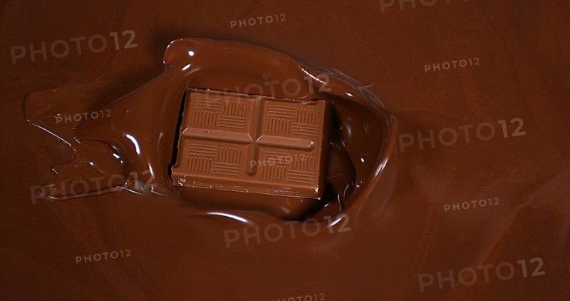 Chocolate tablet falling into Milk Chocolate