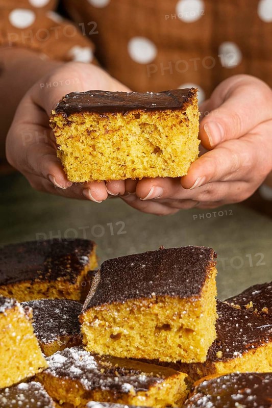 Close up hands holding delicious cake