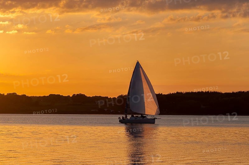 Evening mood, sunset with sailboat on the Flensburg Fjord, view to the Danish coast, Glücksburg, Schleswig-Holstein, Germany, Europe