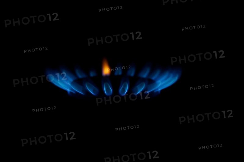 Blue gas flame on a hob, gas cooker, close up