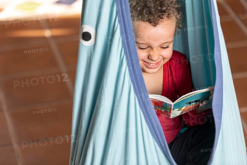 Little boy reading book