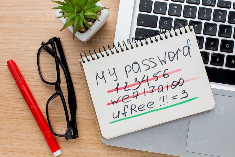 Flat lay notebook with password laptop