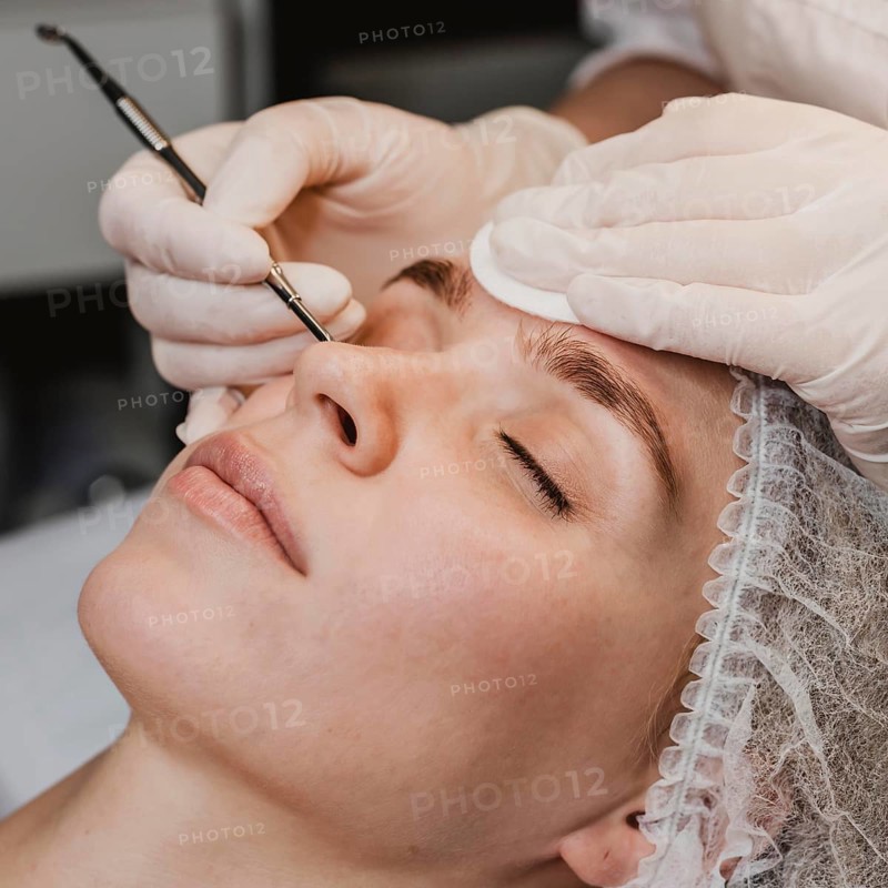 Young woman wellness center during skin treatment