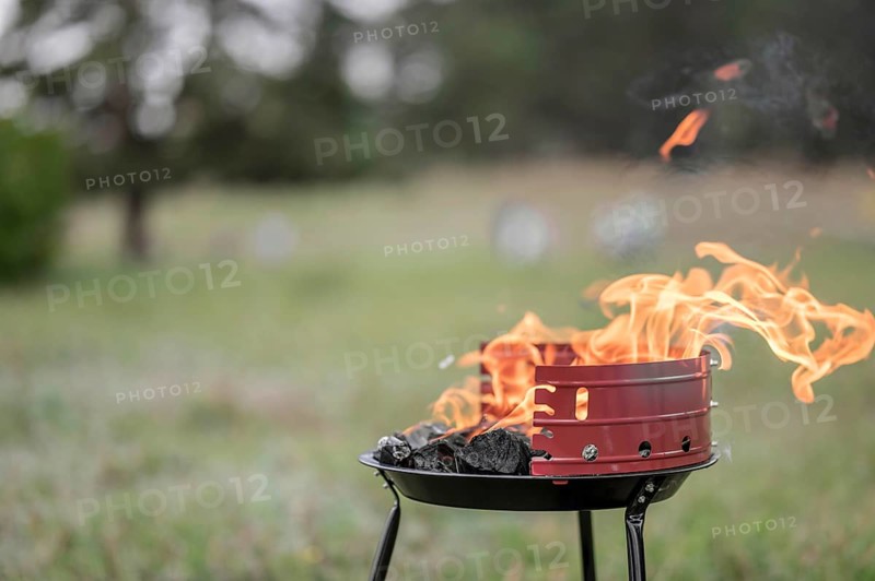 Front view barbecue outdoors with copy space