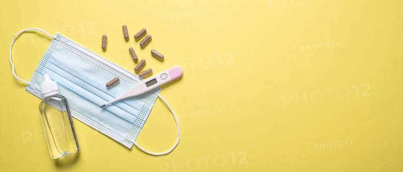 Top view medical mask with pills thermometer