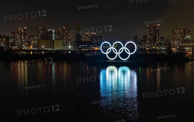 A picture of the illuminated Olympic Rings on display at the Tokyo Bay, at night