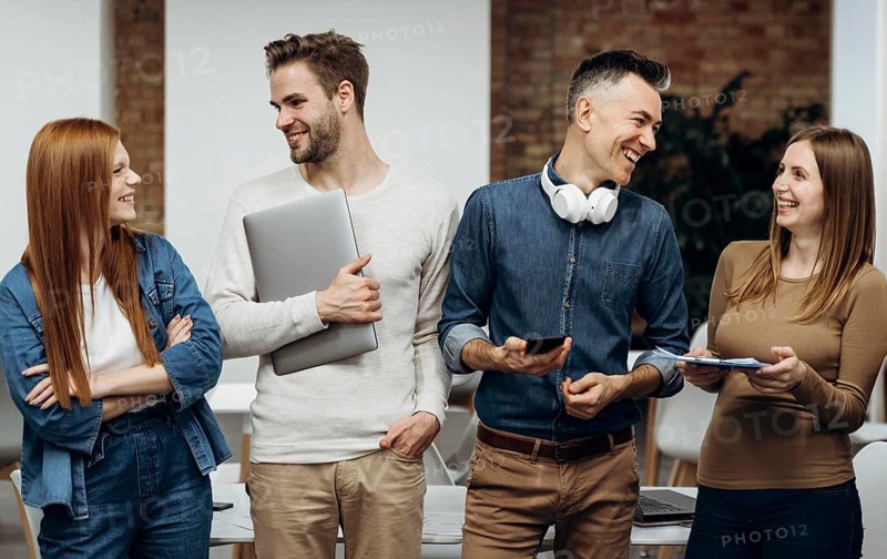 Smiley coworkers talking office