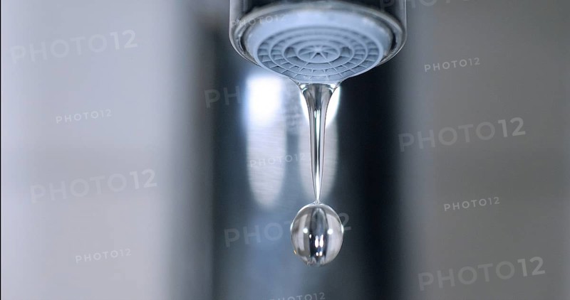 Water Flowing from the Tap, making a drop of water