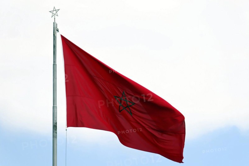 Moroccan national flag, Morocco, The Moroccan flag flies in the wind against a clear sky, The Moroccan flag flies proudly against a clear sky with a green star in the centre, Rabat, North Africa, Africa