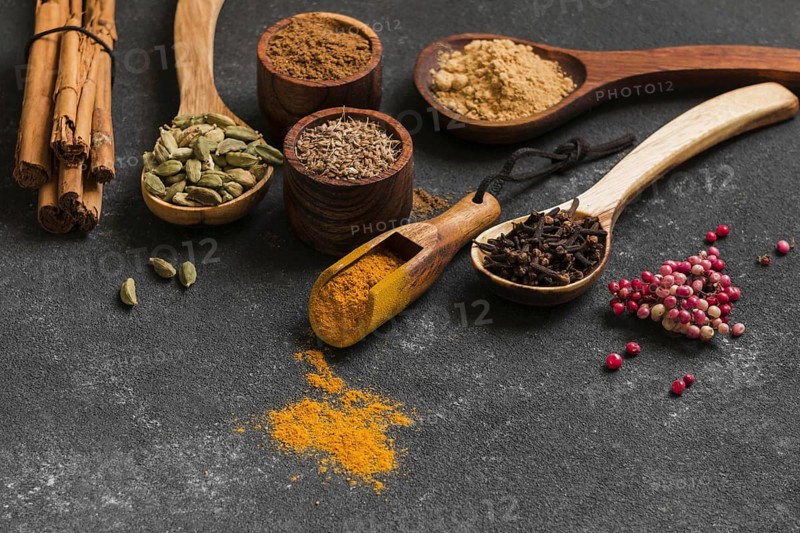 High angle wooden spoons with spices