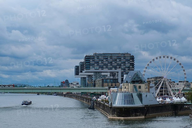 View over the Rhine with crane houses and Ferris wheel, Cologne, Germany, Europe