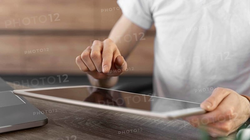 Man using tablet device