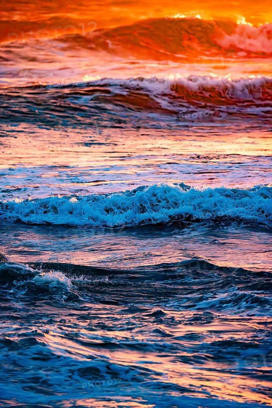 Sunset with high waves at the sea with psychedelic colours, Portbail, English Channel, Cotentin, Manche, Normandy, France, Europe