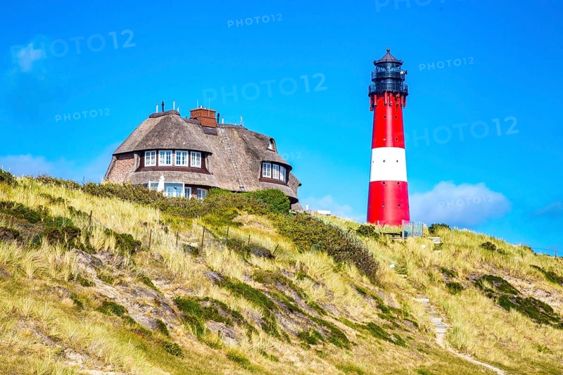 Lighthouse and thatched-roof villa of the Kersig estate in the dunes, Hörnum, Sylt