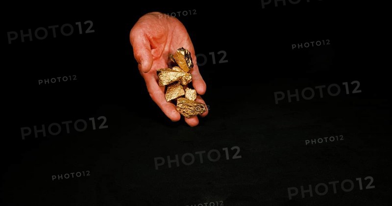 Hand and Gold Nuggets, Nugget, Falling on Black Background