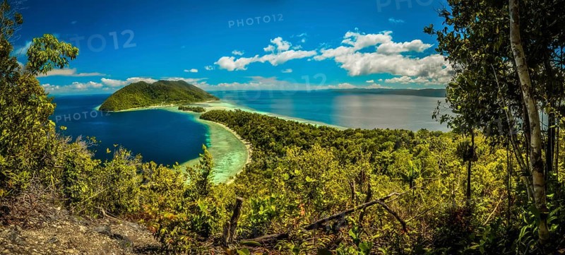 Clear blue sea with wilderness and greenery of Kri island in Raja Ampat in West Papua, Indonesia. In this region, one can only meet people from isolated local tribes