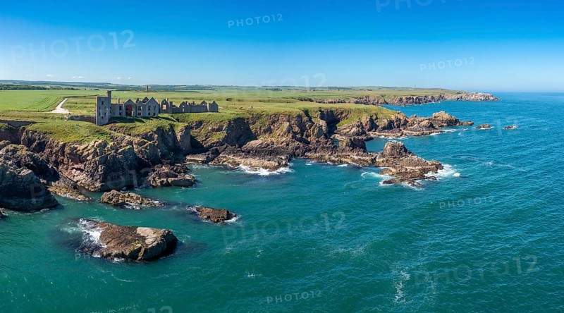 Cruden Bay, United Kingdom - 23 June, 2022: panorama drone view of Slains Castle and the wild coast of Aberdeenshire