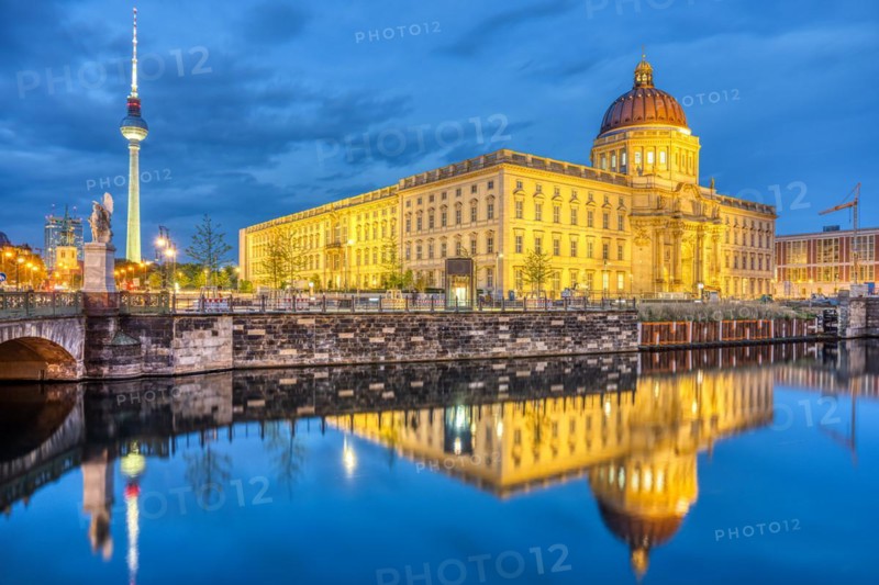 The rebuilt Berlin City Palace and the famous TV Tower by night
