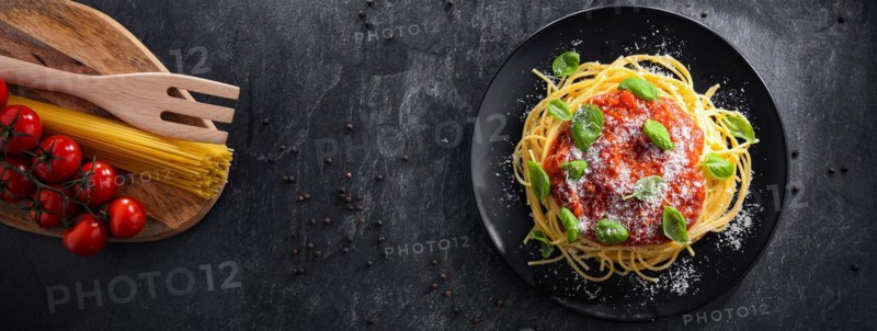 Composition with a plate of spaghetti bolognese