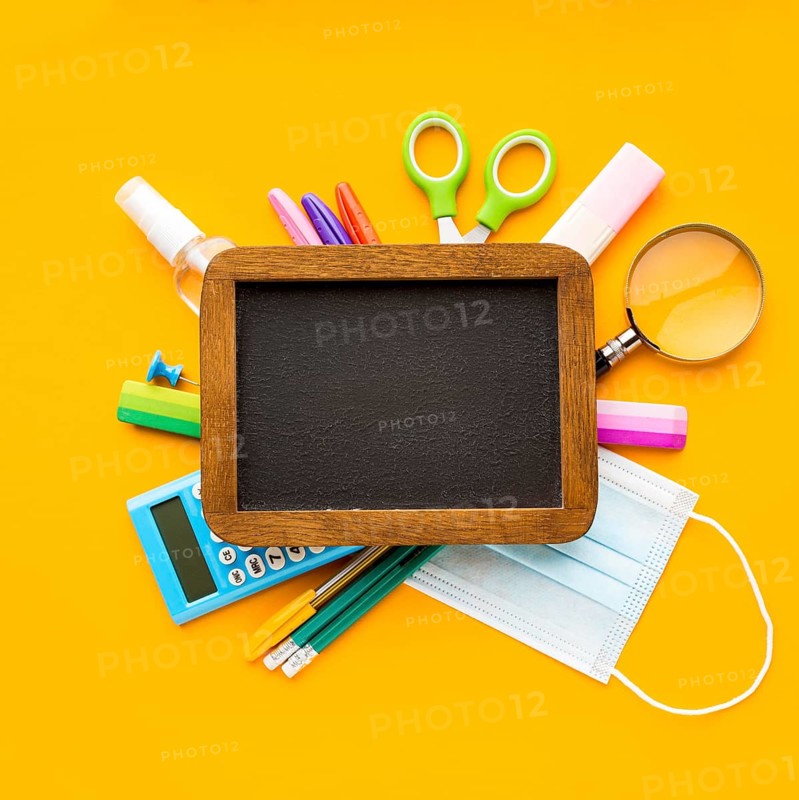 Top view back school essentials with blackboard pencils