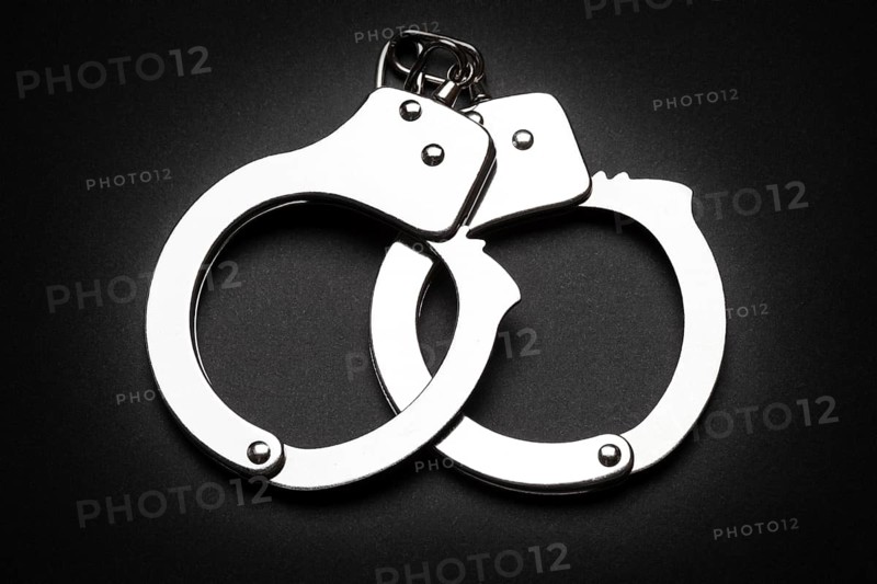 Crime law arrest police steel handcuffs isolated