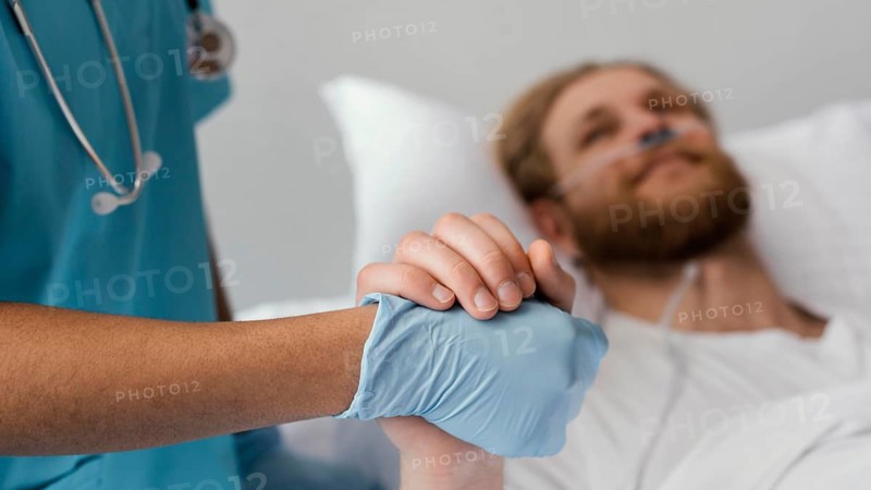 Close up patient health worker holding hands