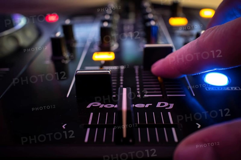 Dj console and hand, bokeh, Pioneer DJ