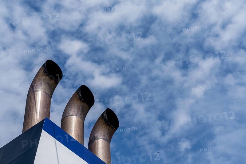 A detail view of three chimney smokestacks of a large passenger ferry