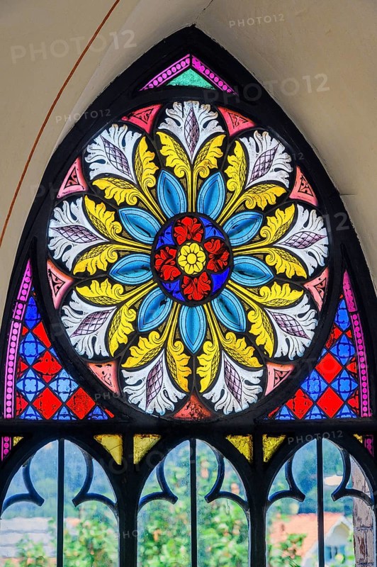Colourful pointed arch window, St. Bartholomew's Parish Church, Hopferbach, Allgäu, Bavaria, Germany, Europe