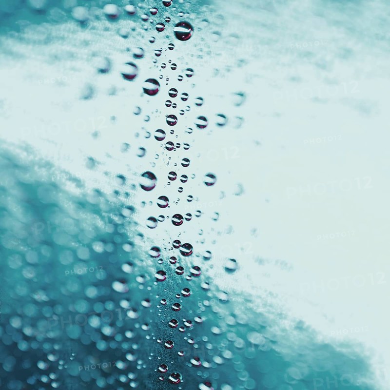 Abstract water drops turquoise glass background. High resolution photo