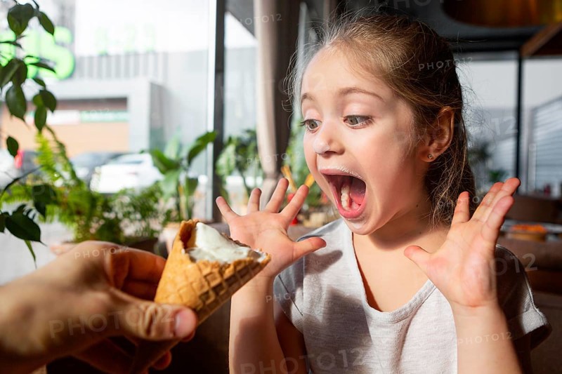 Close up surprised girl with ice cream