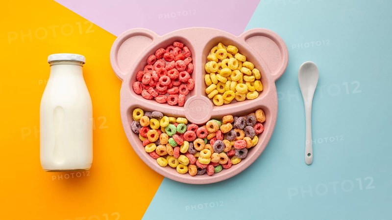 Top view delicious cereal with milk spoon