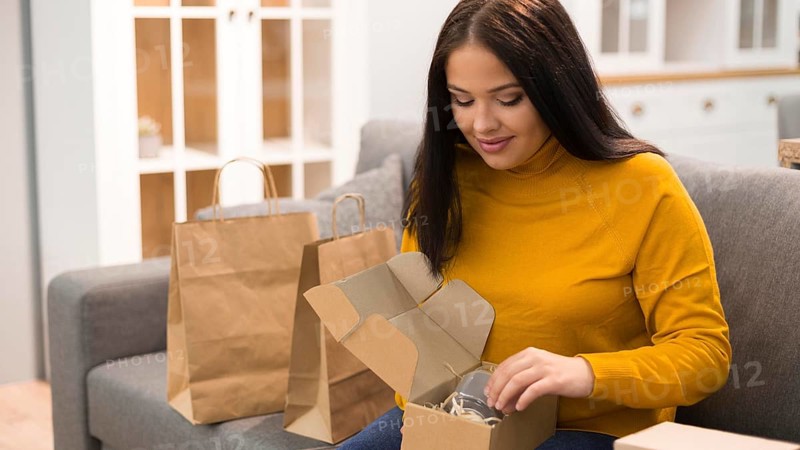 Woman unboxing her new purchase
