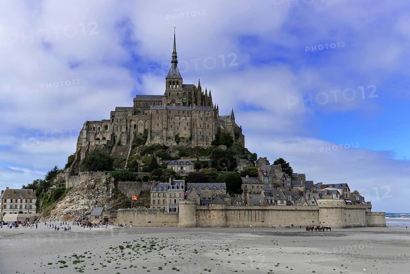 Le Mont-Saint-Michel with the Benedictine abbey on the rocky island of Mont Saint-Michel in the evening light, UNESCO World Heritage Site, Manche, Lower Normandy, France, Europe