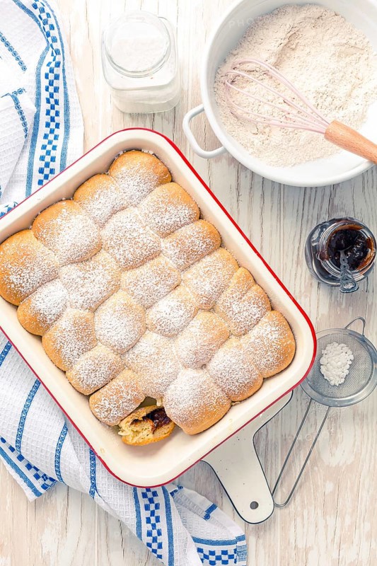Sweet rolls, Buchteln filled with plum jam or jelly with backing ingredients