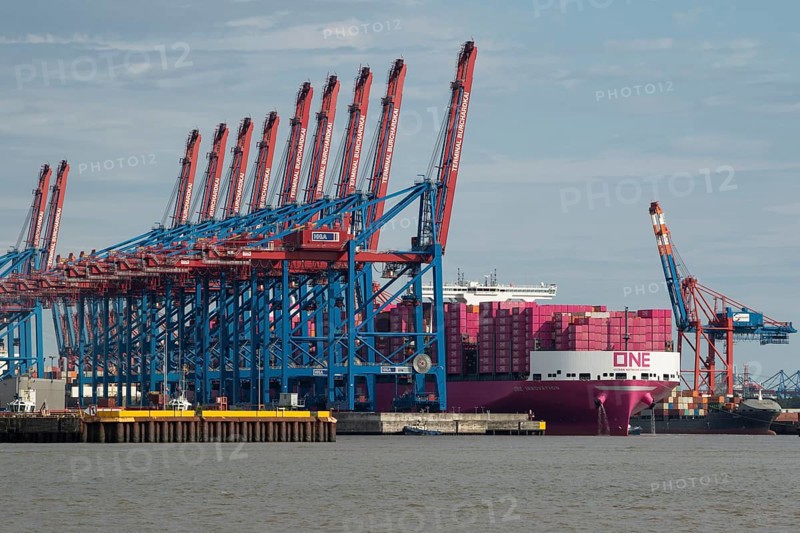 Pink container freighter One Innovation of the shipping company Ocean Network Express (Europe) Ltd. on the Elbe while mooring at Burchardkai in the Port of Hamburg of Hamburg, Germany, Europe