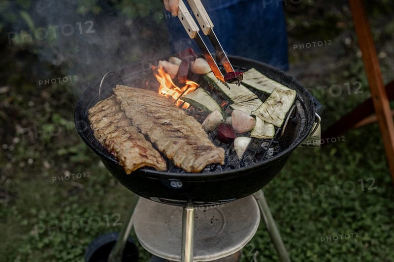 Man barbecuing in the garden