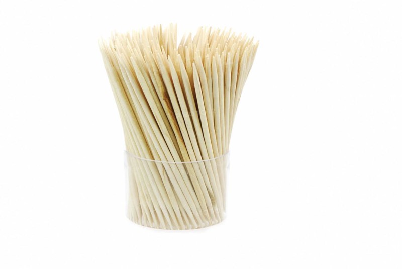 Bunch of wooden toothpicks isolated on white