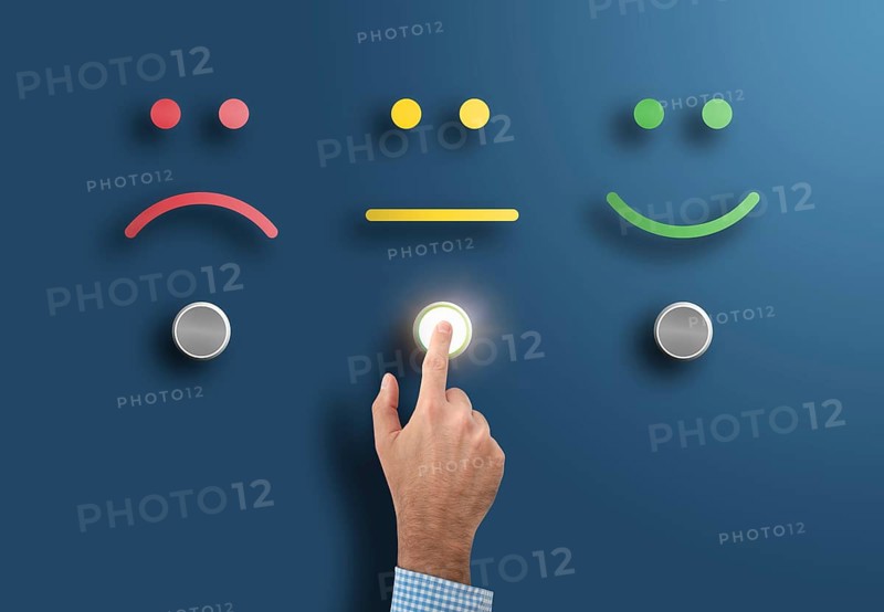 customer service rating and survey concept with hand touching interface button with neutral face
