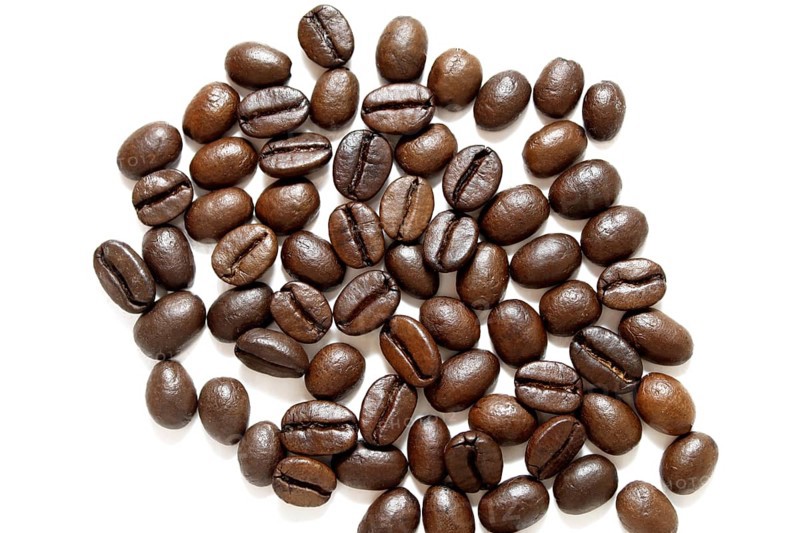 Coffee grains on white background