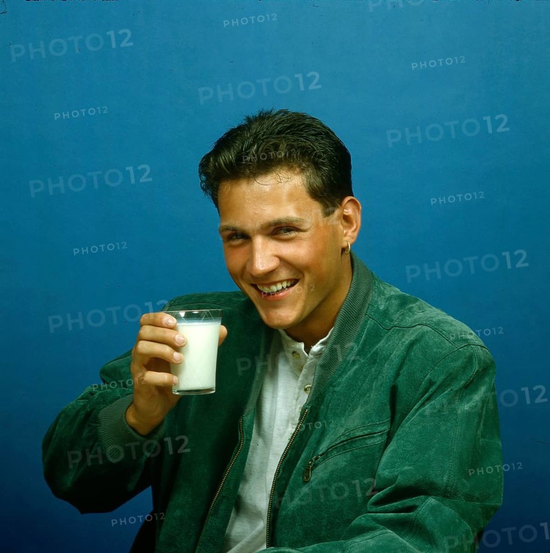 Young man with milk glass