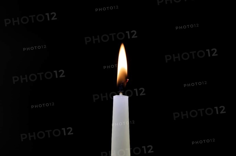 Close-up of a candle flame against a black background