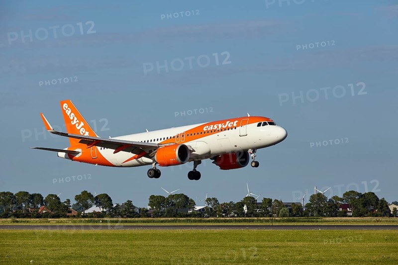 EasyJet Airbus A320-251N with registration G-UZHS lands on the Polderbaan, Amsterdam Schiphol Airport in Vijfhuizen, municipality of Haarlemmermeer, Noord-Holland, Netherlands