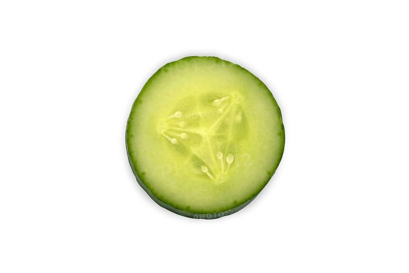 Close-up of a single cucumber slice, Freshly sliced cucumber close-up on a white background