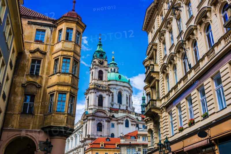 Historic architecture of downtown Prague, Czech Republic. Mostecka Street with St Nicholas Bell Tower