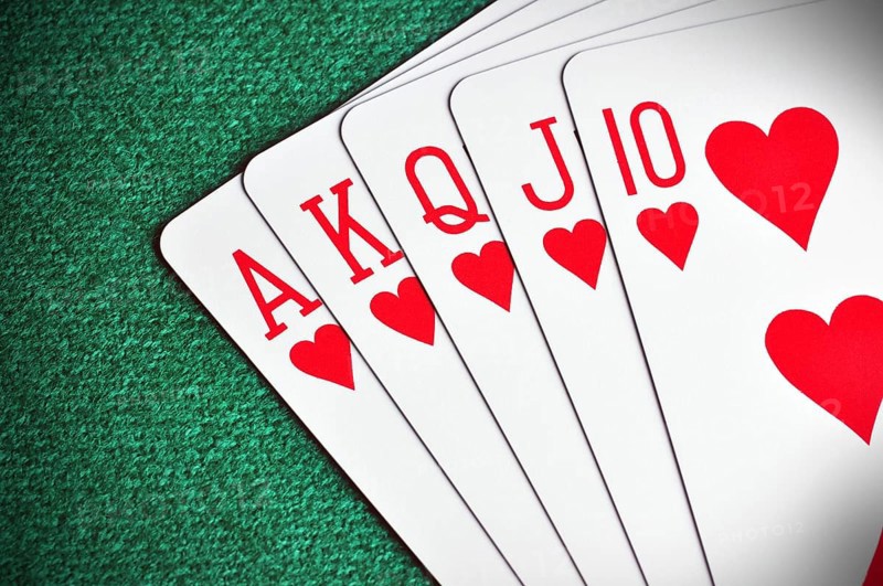 Royal Flush poker card sequence on a green table