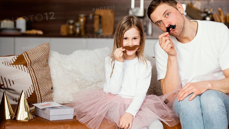 Front view smiley girl tutu skirt father with fake mustaches