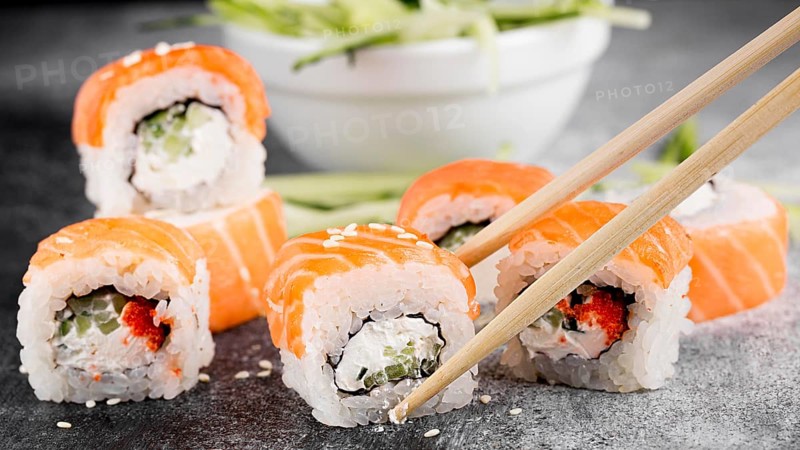 Salad fresh sushi rolls chopsticks