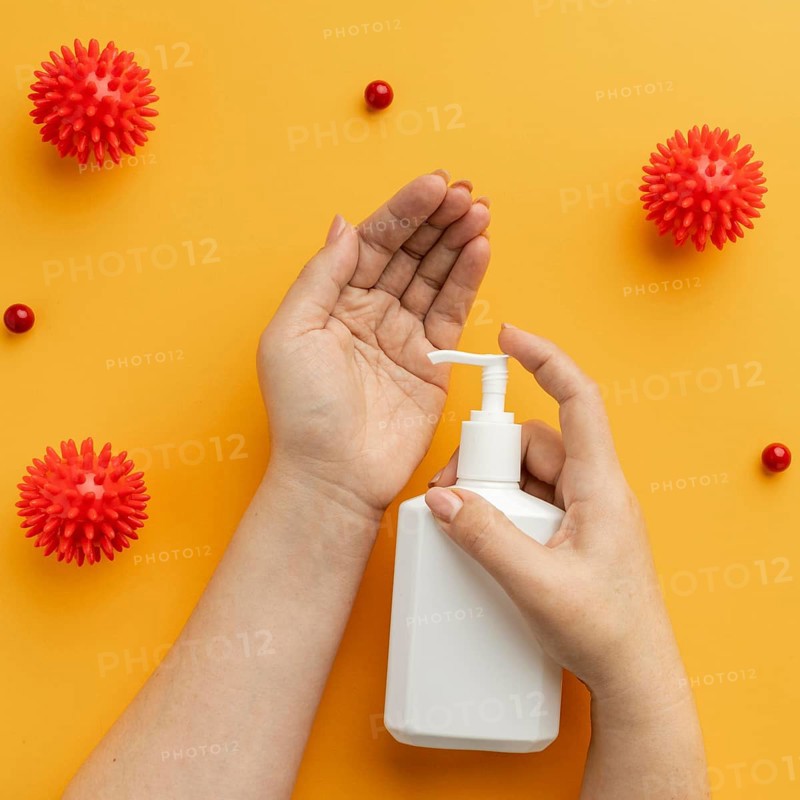 Flat lay hands using liquid soap with viruses